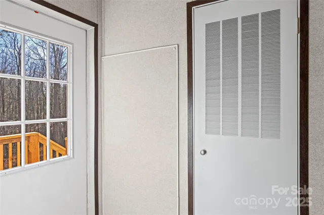 a view of a door and a window