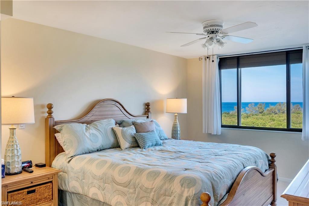 17 Bluebill Avenue, Unit 904 Naples, FL 34108 - Photo 11 of 20 a bedroom with a bed and a window