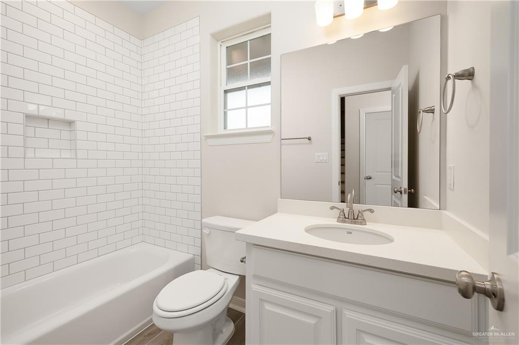 6600 Anaqua Loop McAllen, TX 78504 - Photo 14 of 16 a bathroom with a sink toilet and shower
