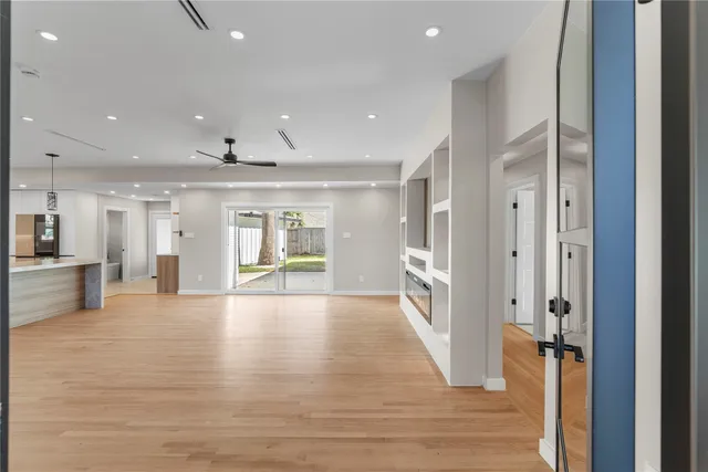 a view of an entryway of a house and livingroom with furniture