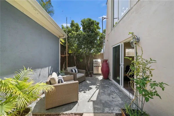 a backyard of a house with outdoor seating