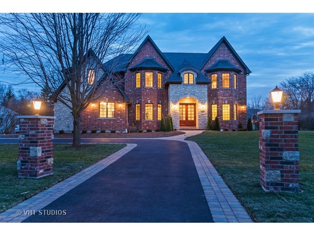 1949 Beechnut Road Northbrook, IL 60062 - Photo 1 of 25 a front view of a house with a yard