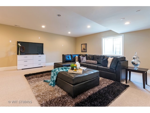 1949 Beechnut Road Northbrook, IL 60062 - Photo 14 of 25 a living room with furniture and a flat screen tv