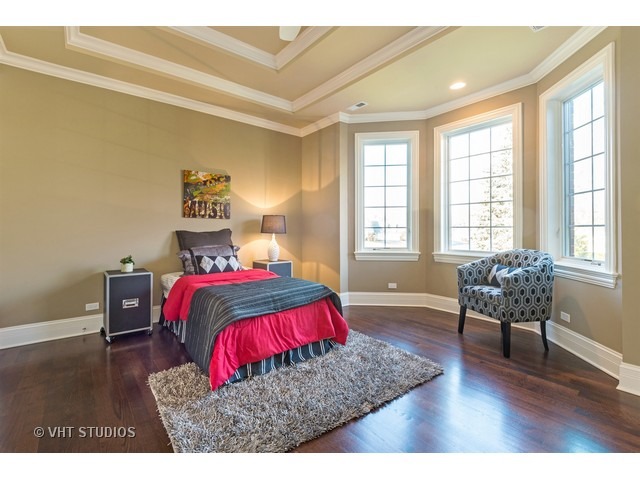 1949 Beechnut Road Northbrook, IL 60062 - Photo 20 of 25 a bedroom with a bed and wooden floor