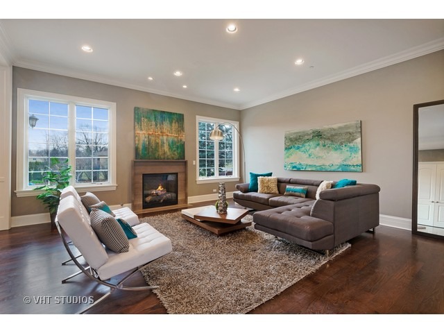 1949 Beechnut Road Northbrook, IL 60062 - Photo 4 of 25 a living room with furniture and a fireplace
