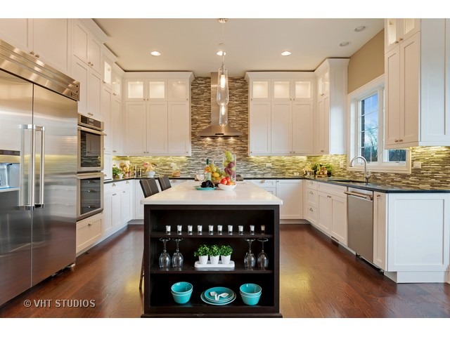 1949 Beechnut Road Northbrook, IL 60062 - Photo 5 of 25 a kitchen with a stove a sink and a refrigerator
