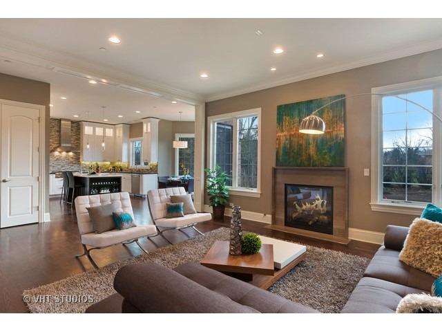 1949 Beechnut Road Northbrook, IL 60062 - Photo 7 of 25 a living room with furniture and a fireplace