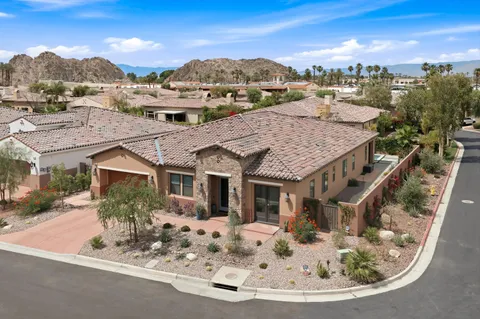 a aerial view of a house with a yard