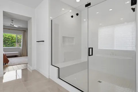 a bathroom with a shower and a tub