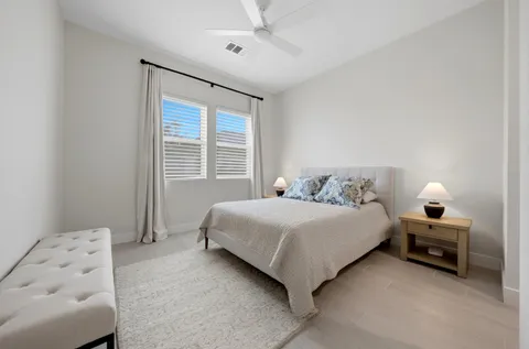 a bedroom with bed and window