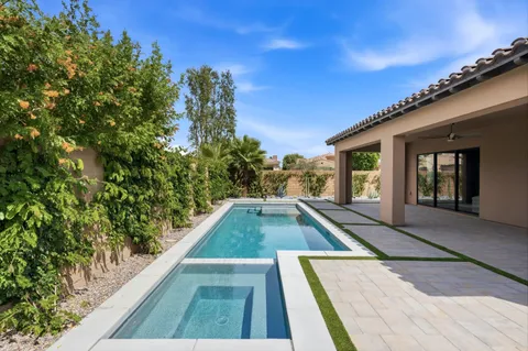 a view of swimming pool with seating area