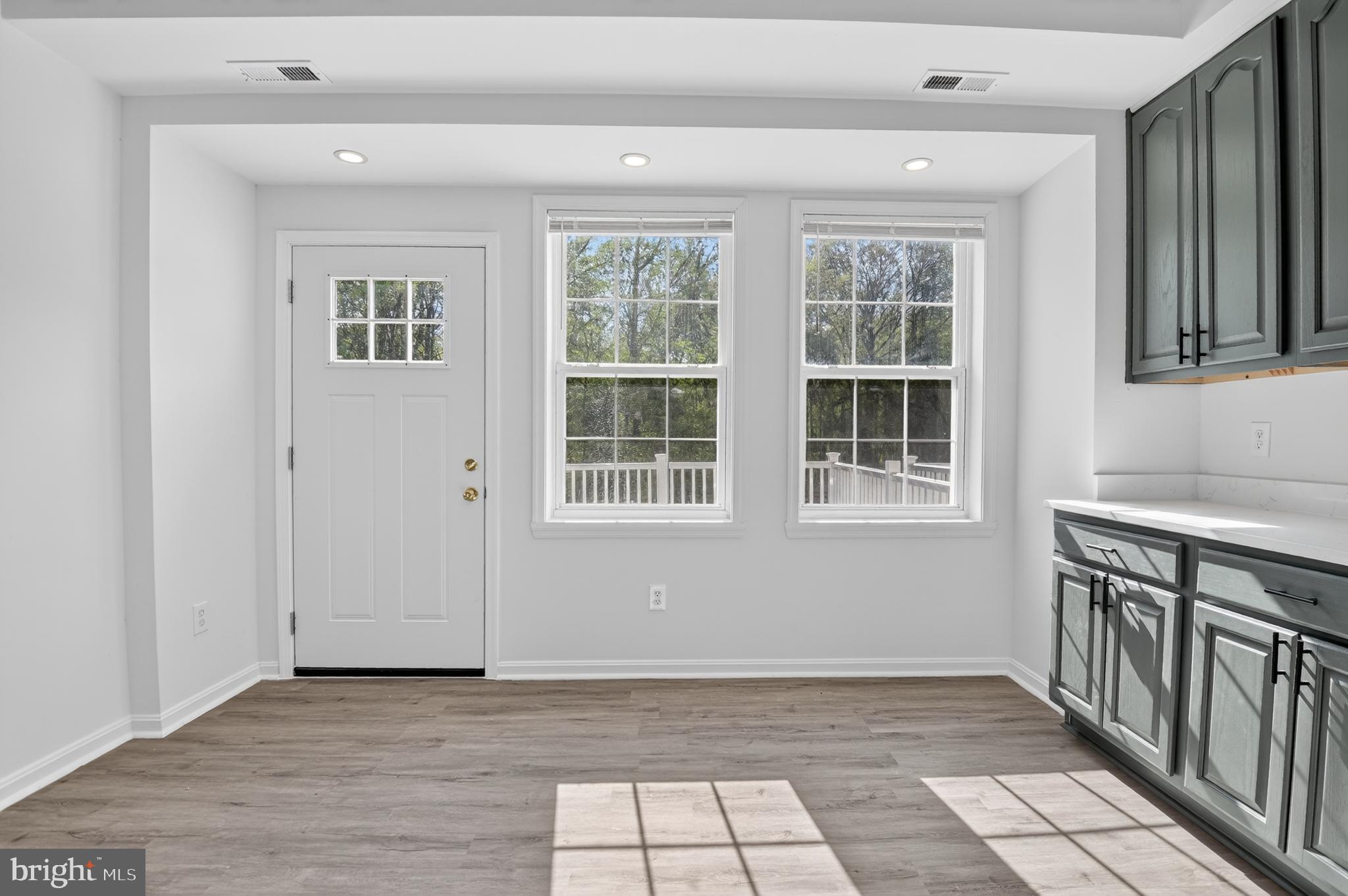280 Brock Bridge Road Laurel, MD 20724 - Photo 11 of 22 an empty room with wooden floor and windows