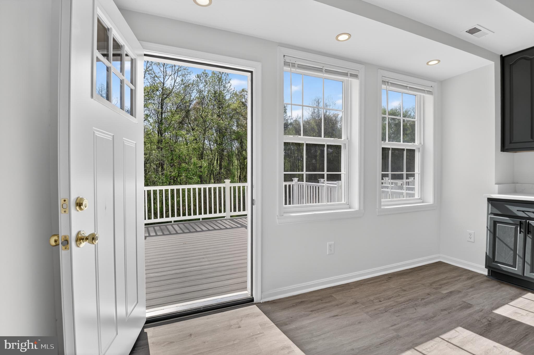 280 Brock Bridge Road Laurel, MD 20724 - Photo 12 of 22 an empty room with wooden floor and windows