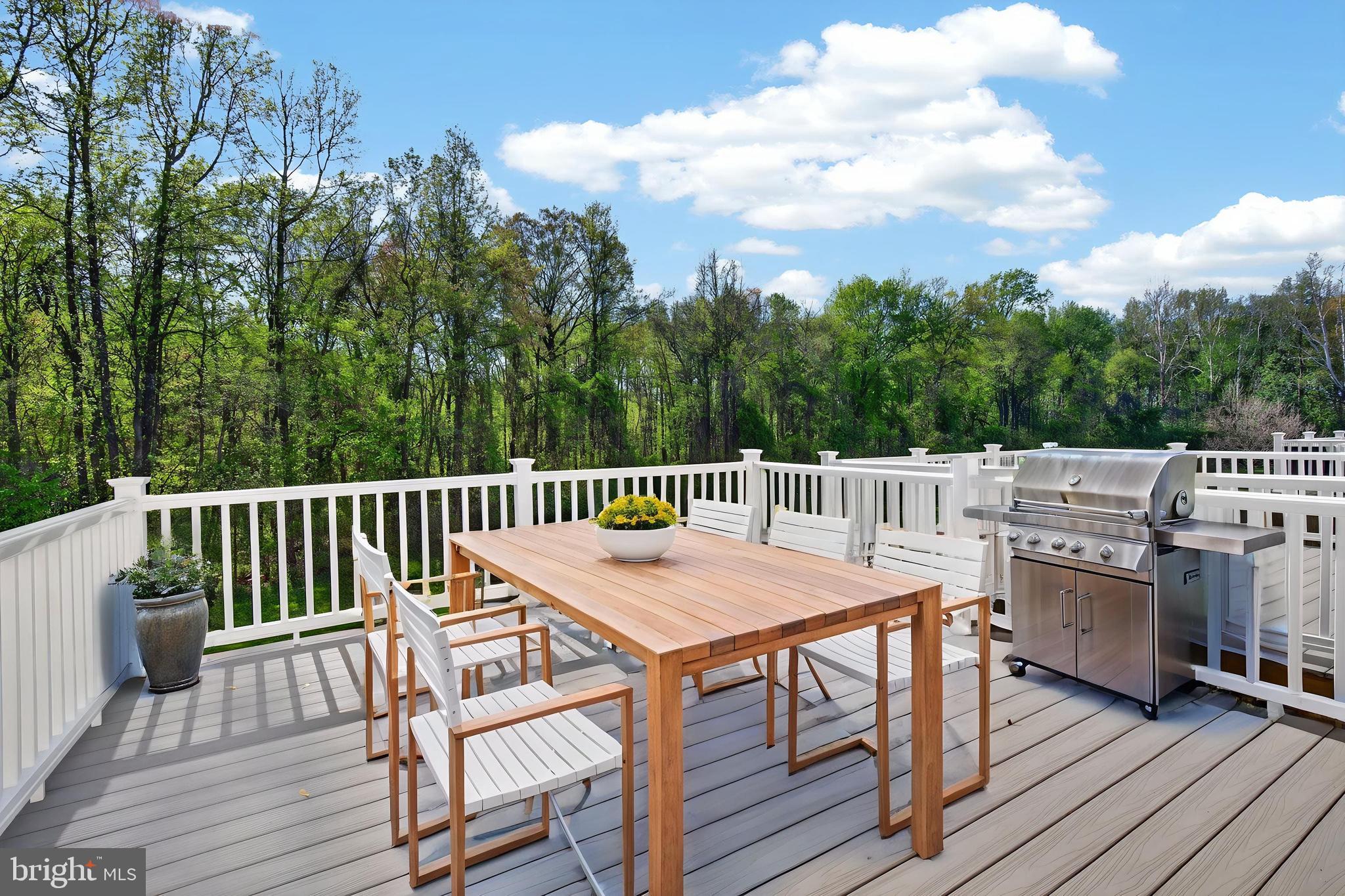 280 Brock Bridge Road Laurel, MD 20724 - Photo 13 of 22 a balcony with wooden floor table and chairs