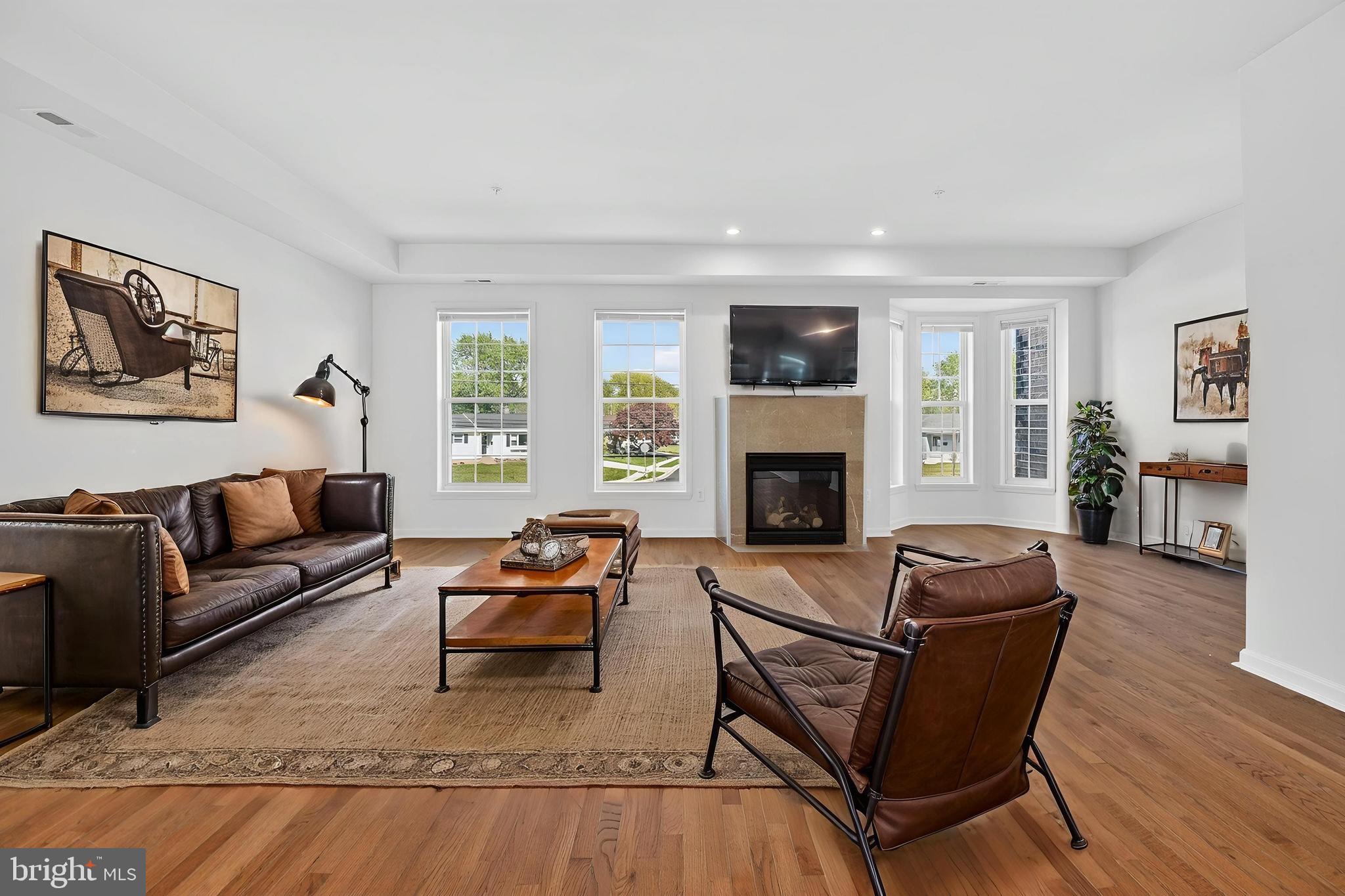 280 Brock Bridge Road Laurel, MD 20724 - Photo 4 of 22 a living room with furniture and a fireplace