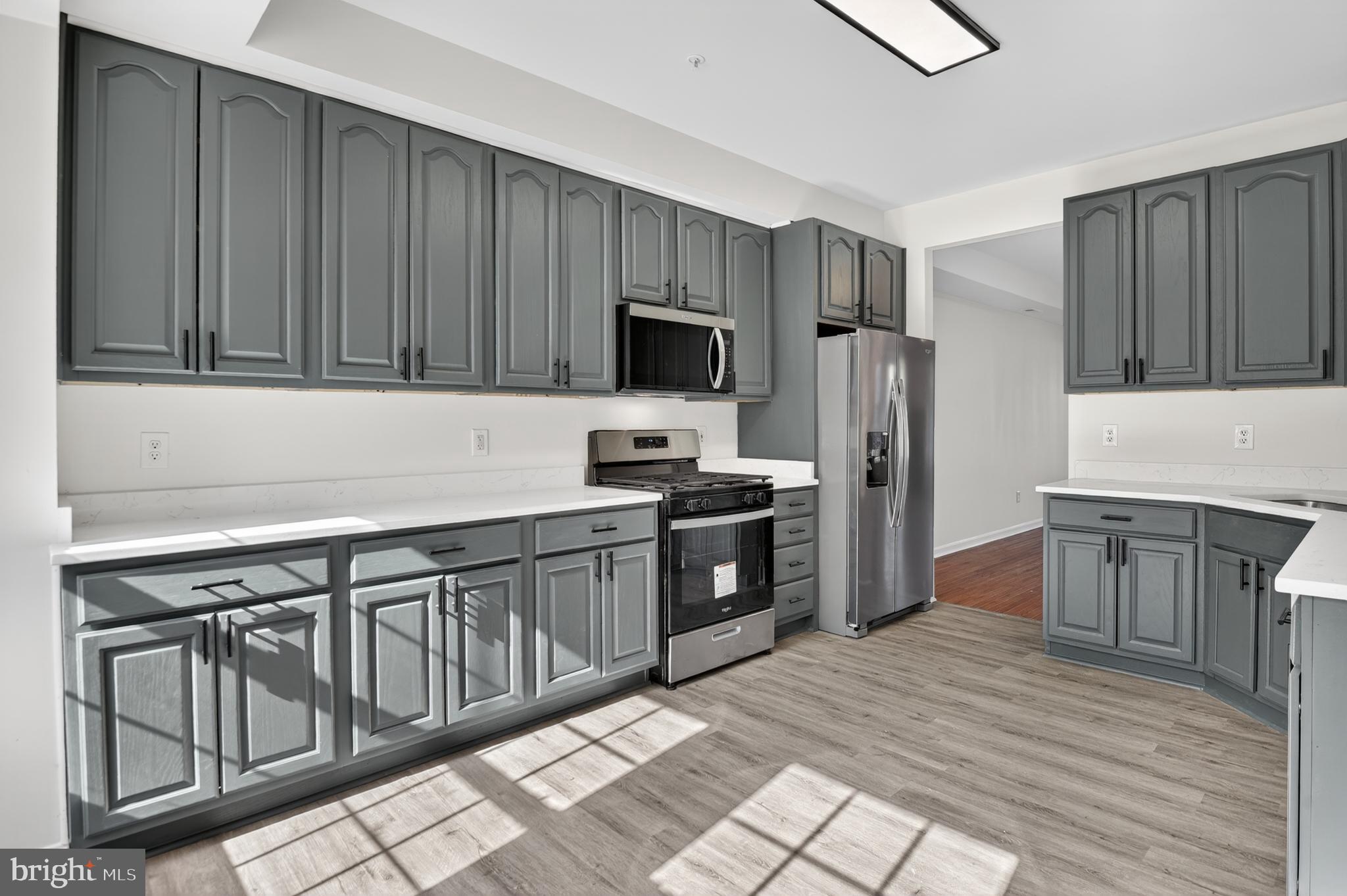 280 Brock Bridge Road Laurel, MD 20724 - Photo 7 of 22 a kitchen with granite countertop a refrigerator stove top oven and sink