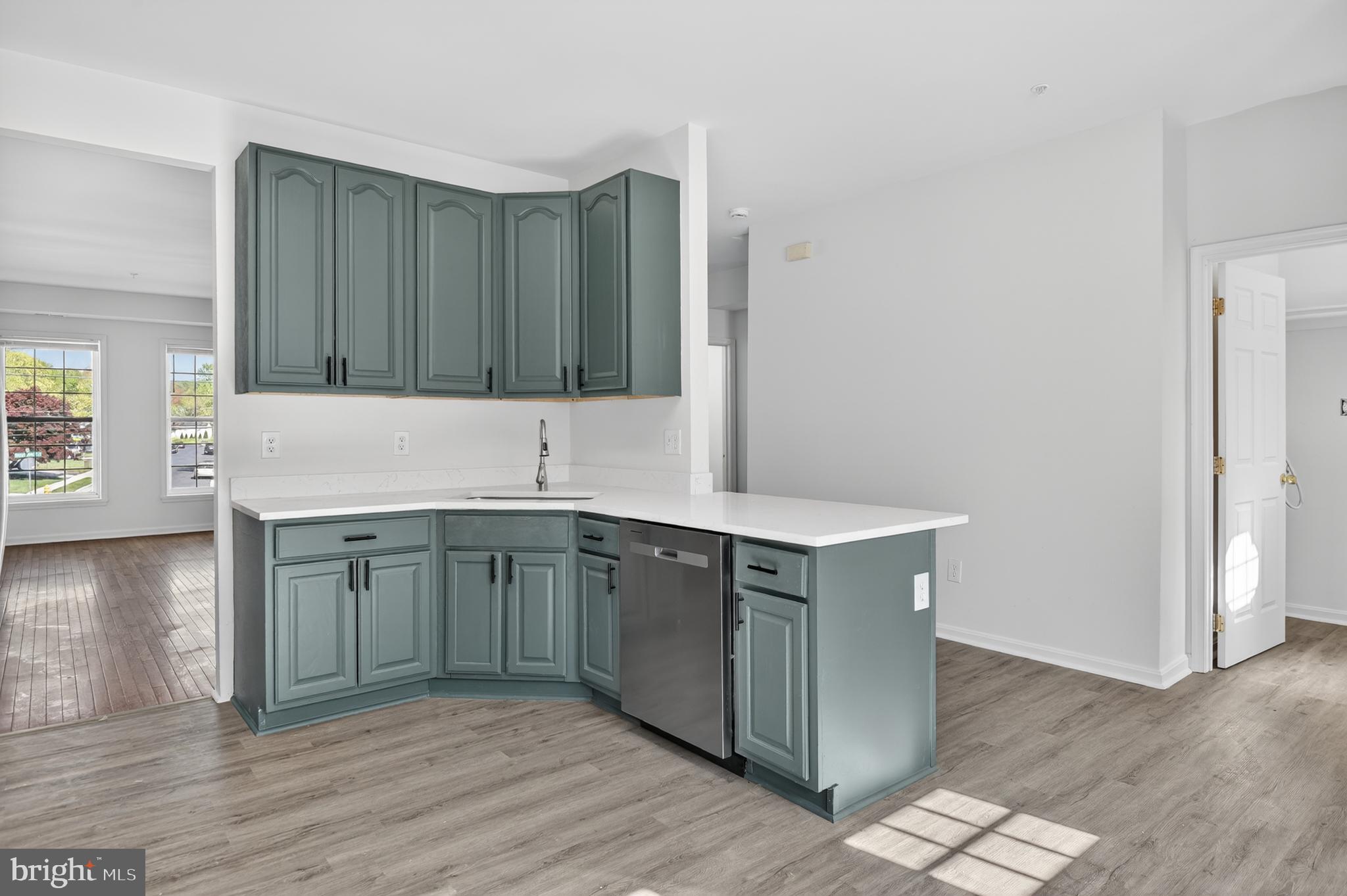 280 Brock Bridge Road Laurel, MD 20724 - Photo 8 of 22 a kitchen with stainless steel appliances granite countertop a sink stove and cabinets