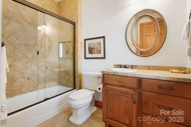 a living room with furniture a fireplace and a table