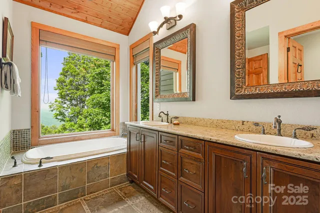 a view of a patio with table and chairs and wooden floor