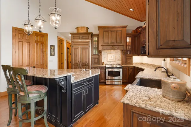 a view of a balcony with chairs and wooden floor