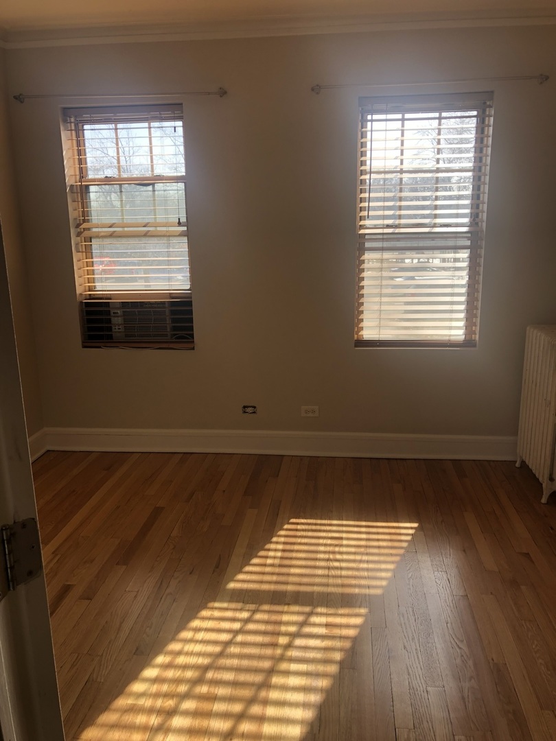 70 Pine Avenue, Unit 1A Riverside, IL 60546 - Photo 7 of 7 a view of a room with wooden floor and windows