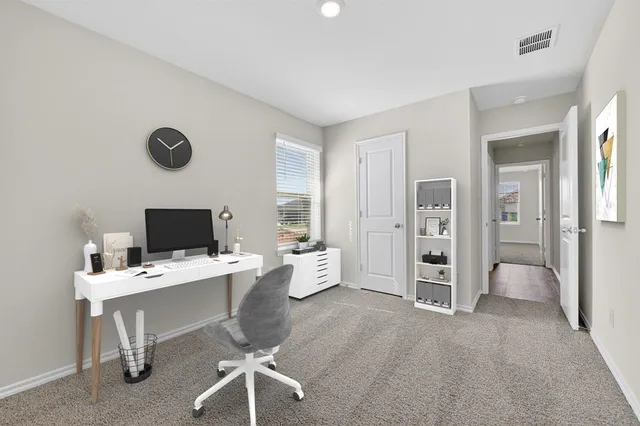 a room with furniture and white walls