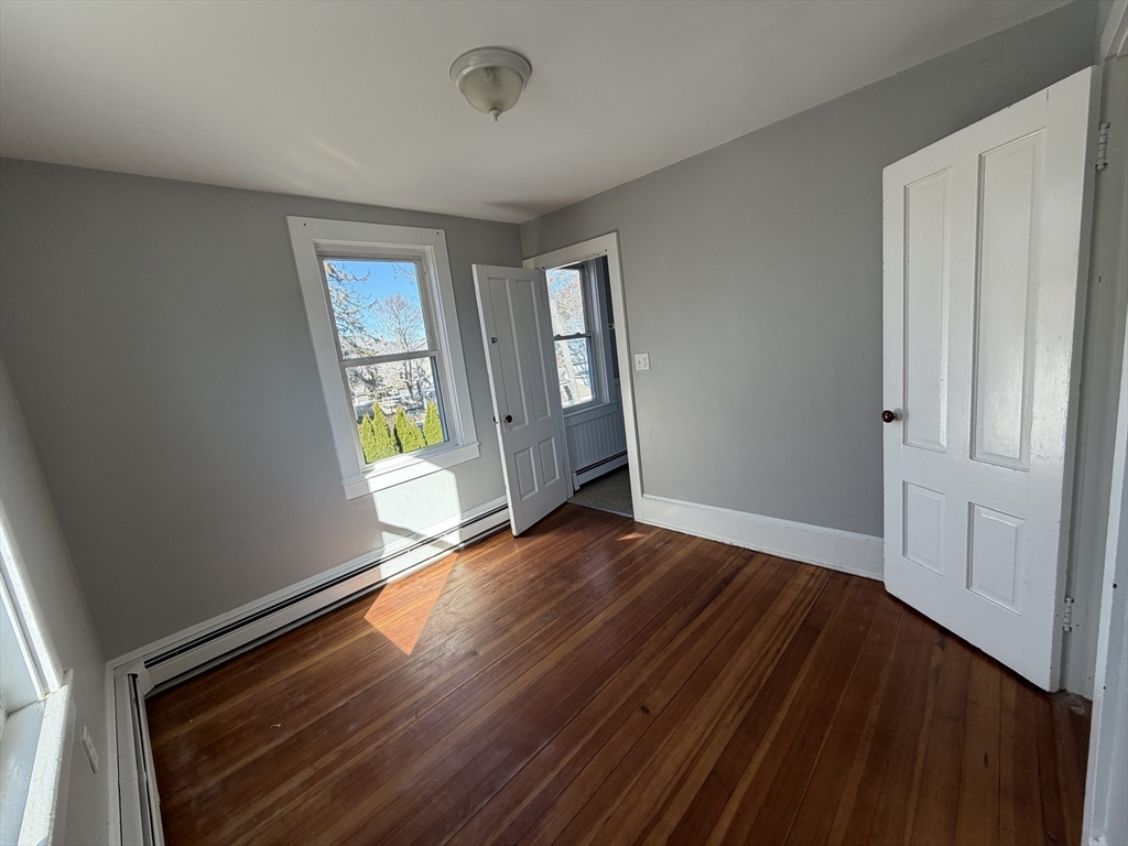 1 Hamilton Street, Unit 2 Plymouth, MA 02360 - Photo 3 of 12 wooden floor in an empty room with a window