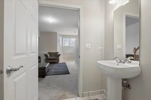 a en suite bathroom with a sink and mirror