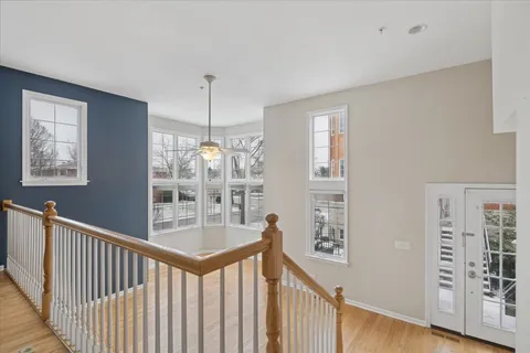 a view of a hallway with windows