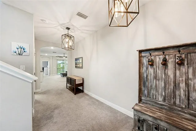 a view of an empty room and wooden floor