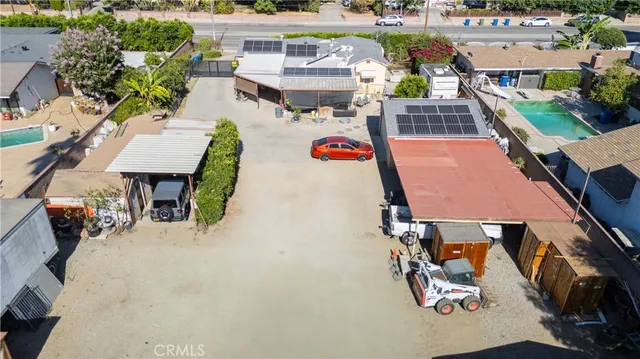 an aerial view of a house with wooden floor