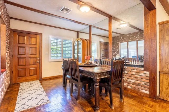 a spacious bedroom with a large bed and a chandelier
