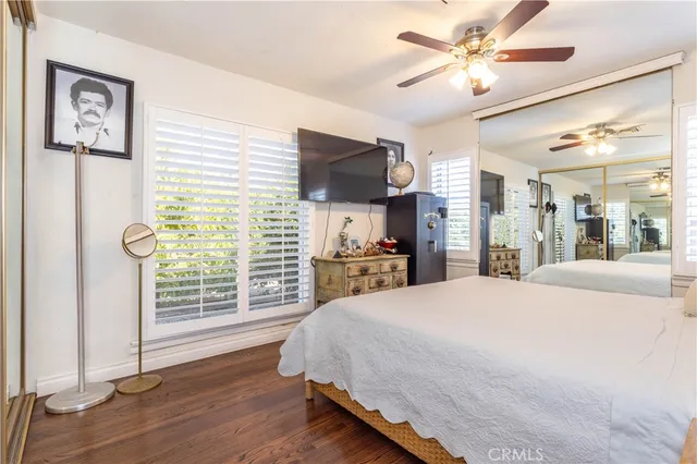 a bedroom with bed and window