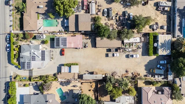 an aerial view of multiple houses with outdoor space