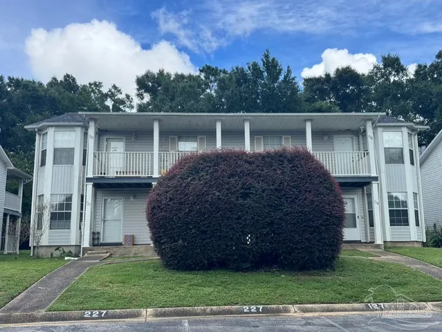 a view of a house with a garden