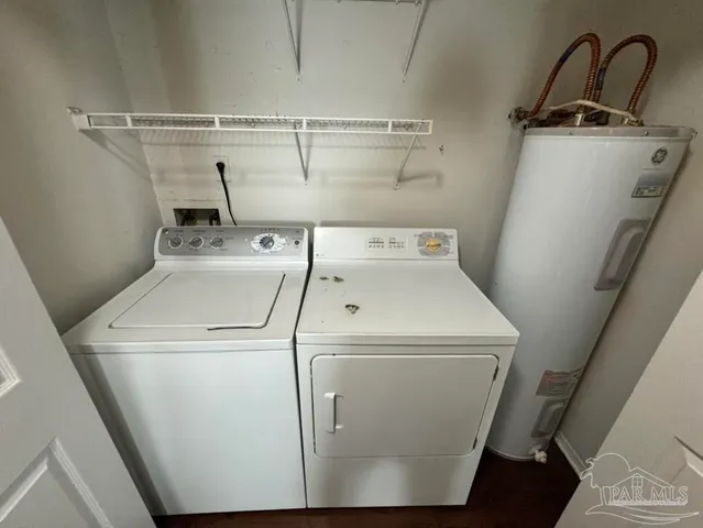a bathroom with a bath tub with a shower