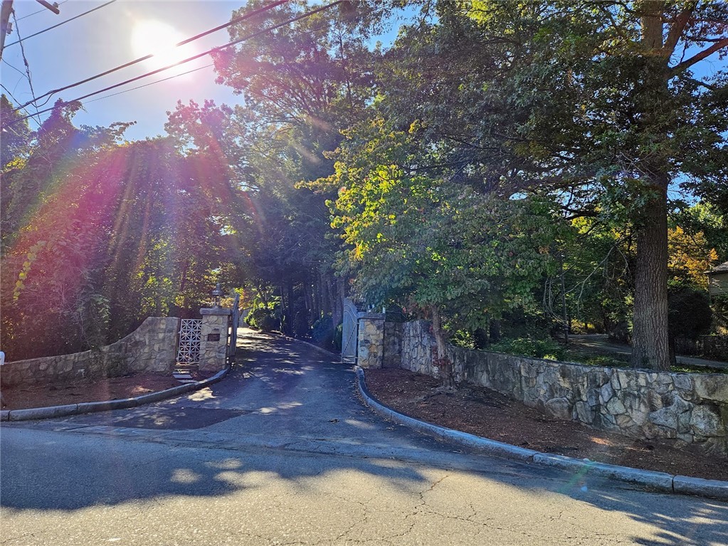 381 Angell Road Lincoln, RI 02865 - Photo 2 of 14 Stone Wall at entry with wrought iron gate