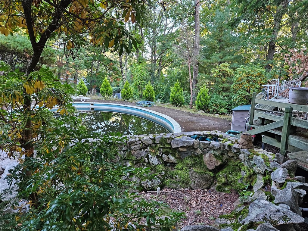 381 Angell Road Lincoln, RI 02865 - Photo 9 of 14 and man made stone pond