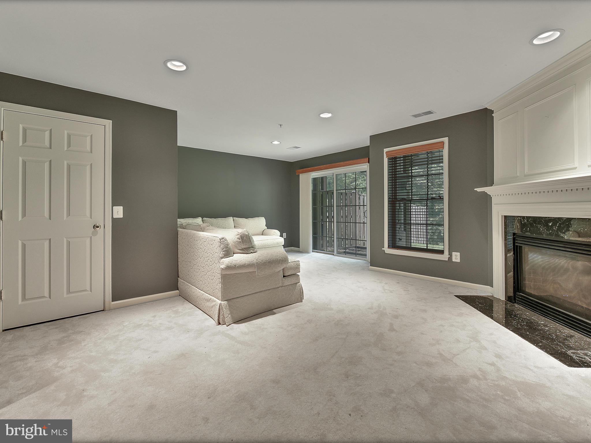 13907 Lullaby Road Germantown, MD 20874 - Photo 33 of 41 Lover level family rec room with gas fireplace