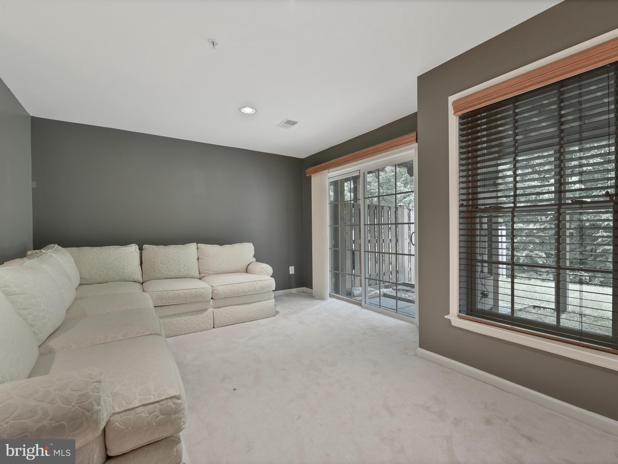 13907 Lullaby Road Germantown, MD 20874 - Photo 34 of 41 Lover level family rec room with gas fireplace
