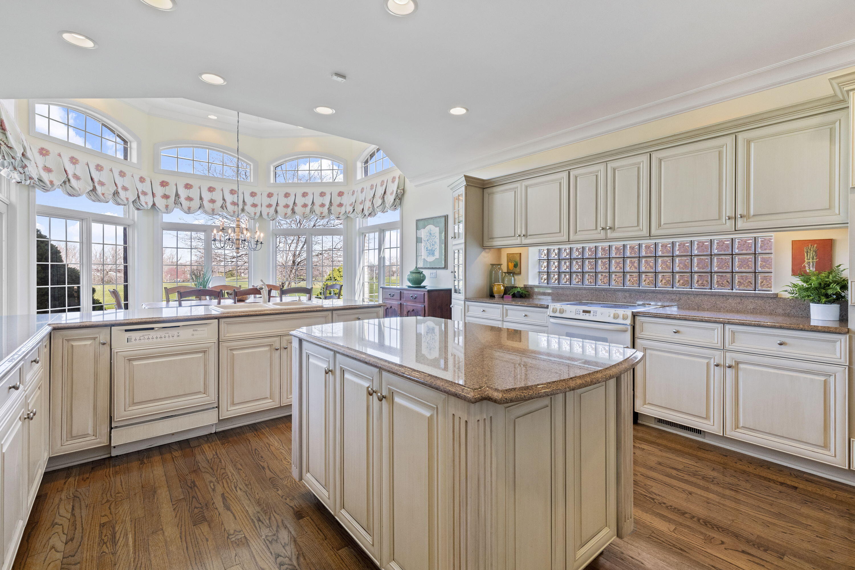 1663 Snead Avenue Chesterton, IN 46304 - Photo 11 of 38 a kitchen with granite countertop a sink a counter top space and cabinets
