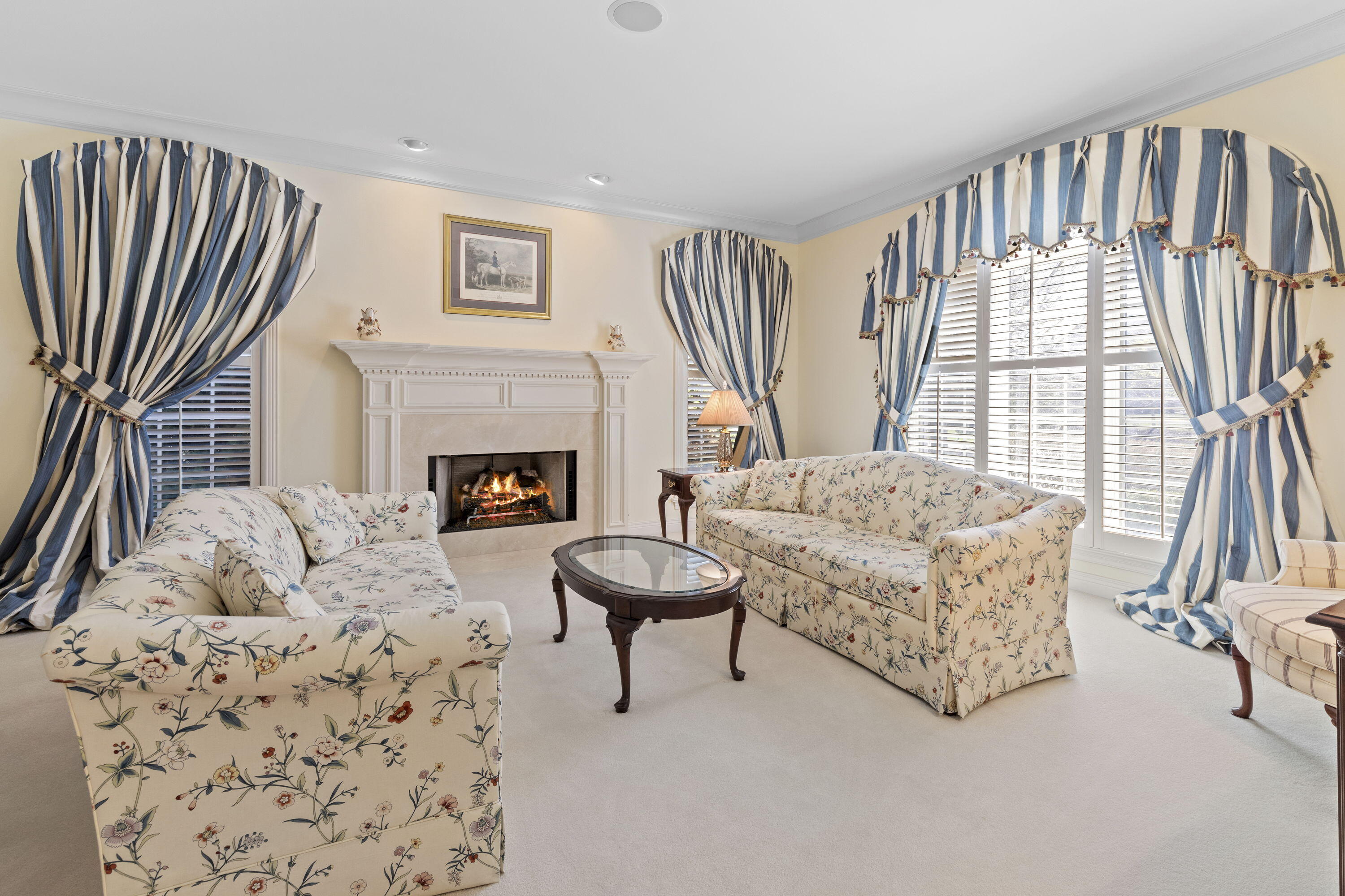 1663 Snead Avenue Chesterton, IN 46304 - Photo 15 of 38 a living room with furniture a fireplace and a large window
