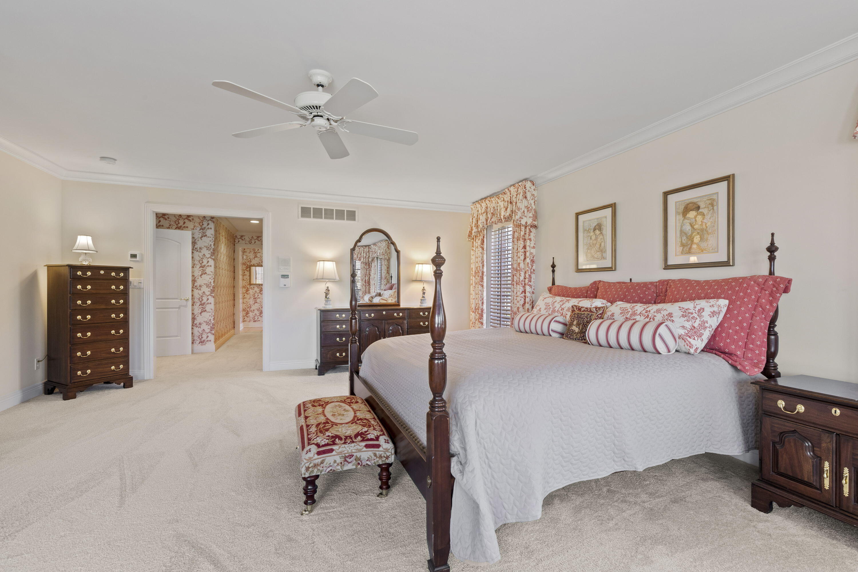 1663 Snead Avenue Chesterton, IN 46304 - Photo 17 of 38 a bedroom with a large bed and a chandelier