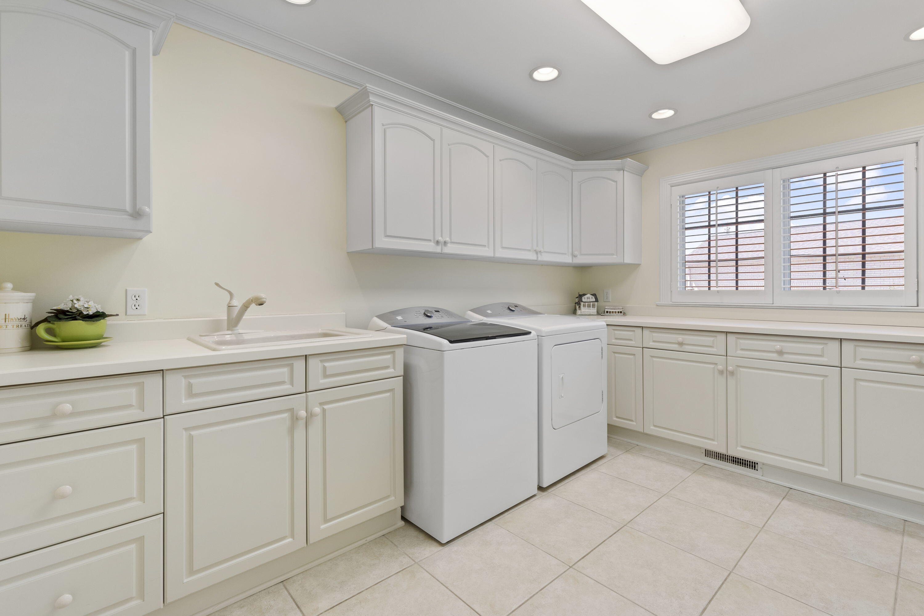 1663 Snead Avenue Chesterton, IN 46304 - Photo 22 of 38 a kitchen with white cabinets and white appliances