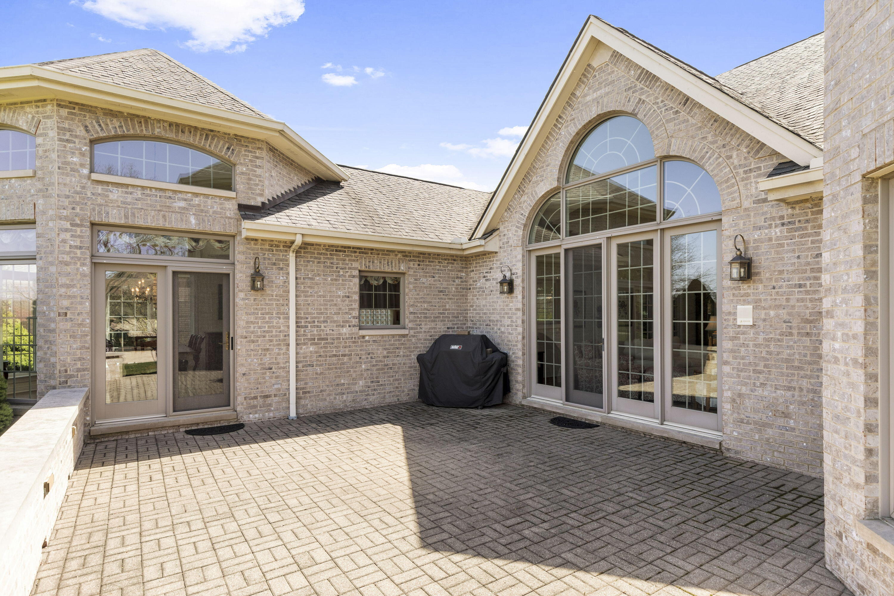 1663 Snead Avenue Chesterton, IN 46304 - Photo 32 of 38 a view of a brick house with many windows
