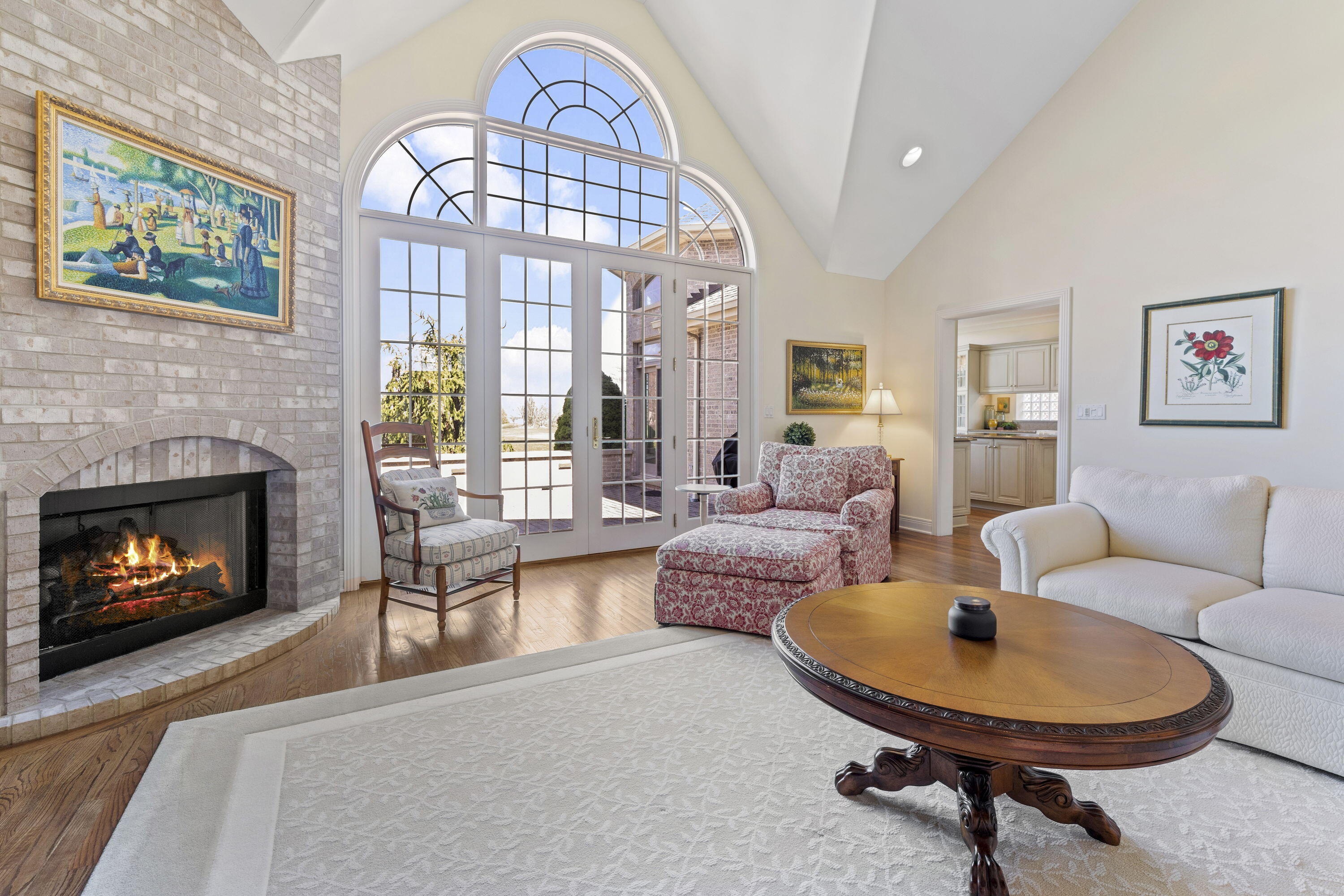 1663 Snead Avenue Chesterton, IN 46304 - Photo 7 of 38 a living room with furniture a fireplace and a large window