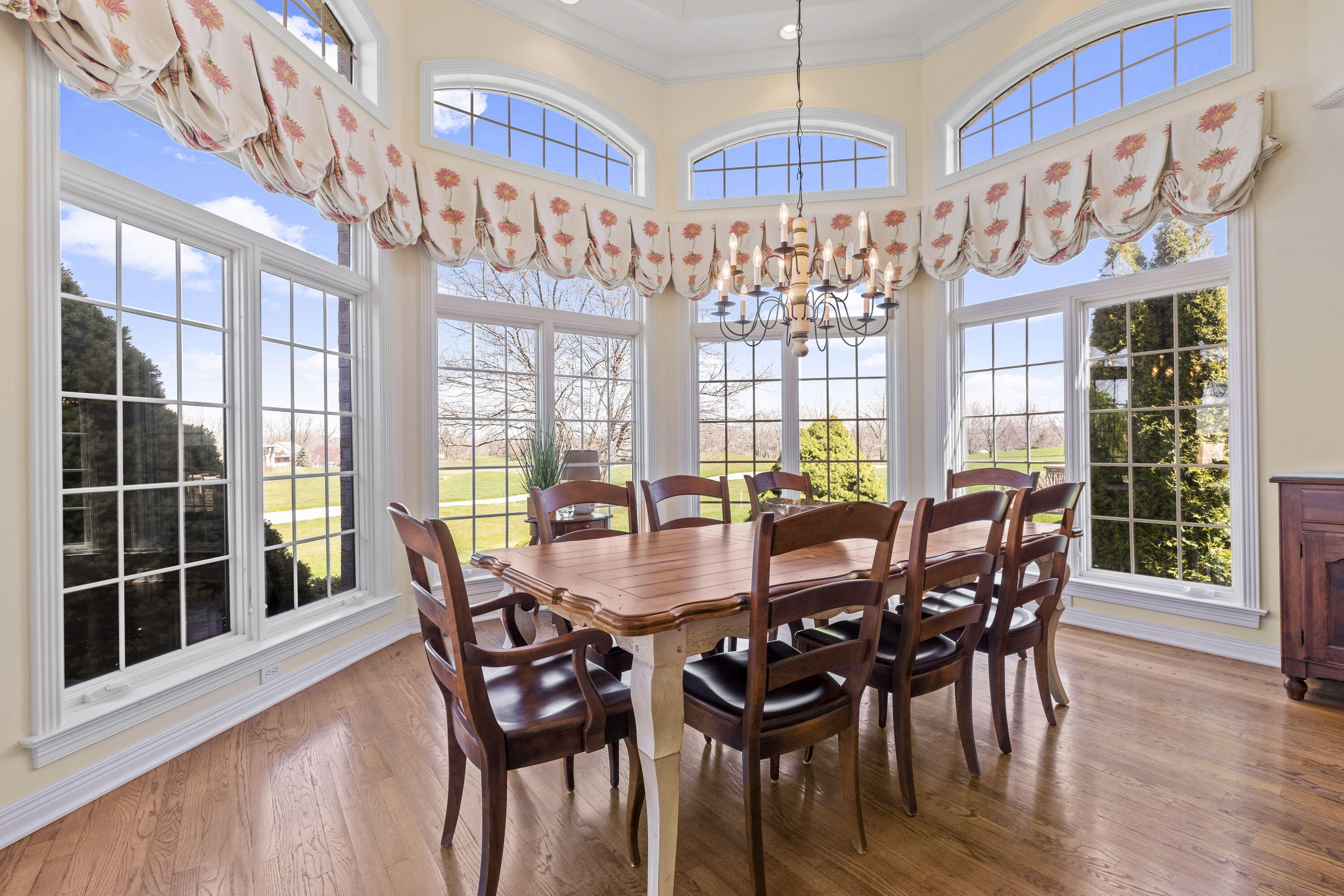1663 Snead Avenue Chesterton, IN 46304 - Photo 9 of 38 a view of a dining room with furniture a chandelier and wooden floor