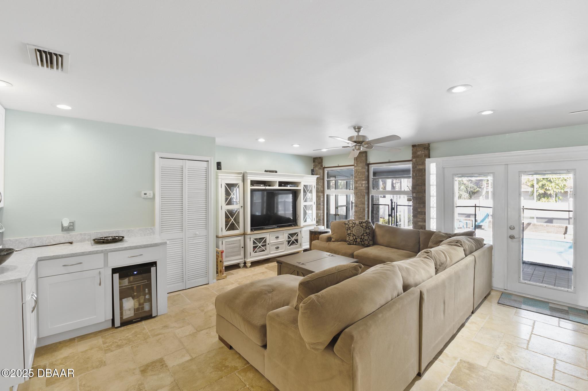 13 Fernery Trail Ormond Beach, FL 32174 - Photo 17 of 57 a living room with furniture and a flat screen tv