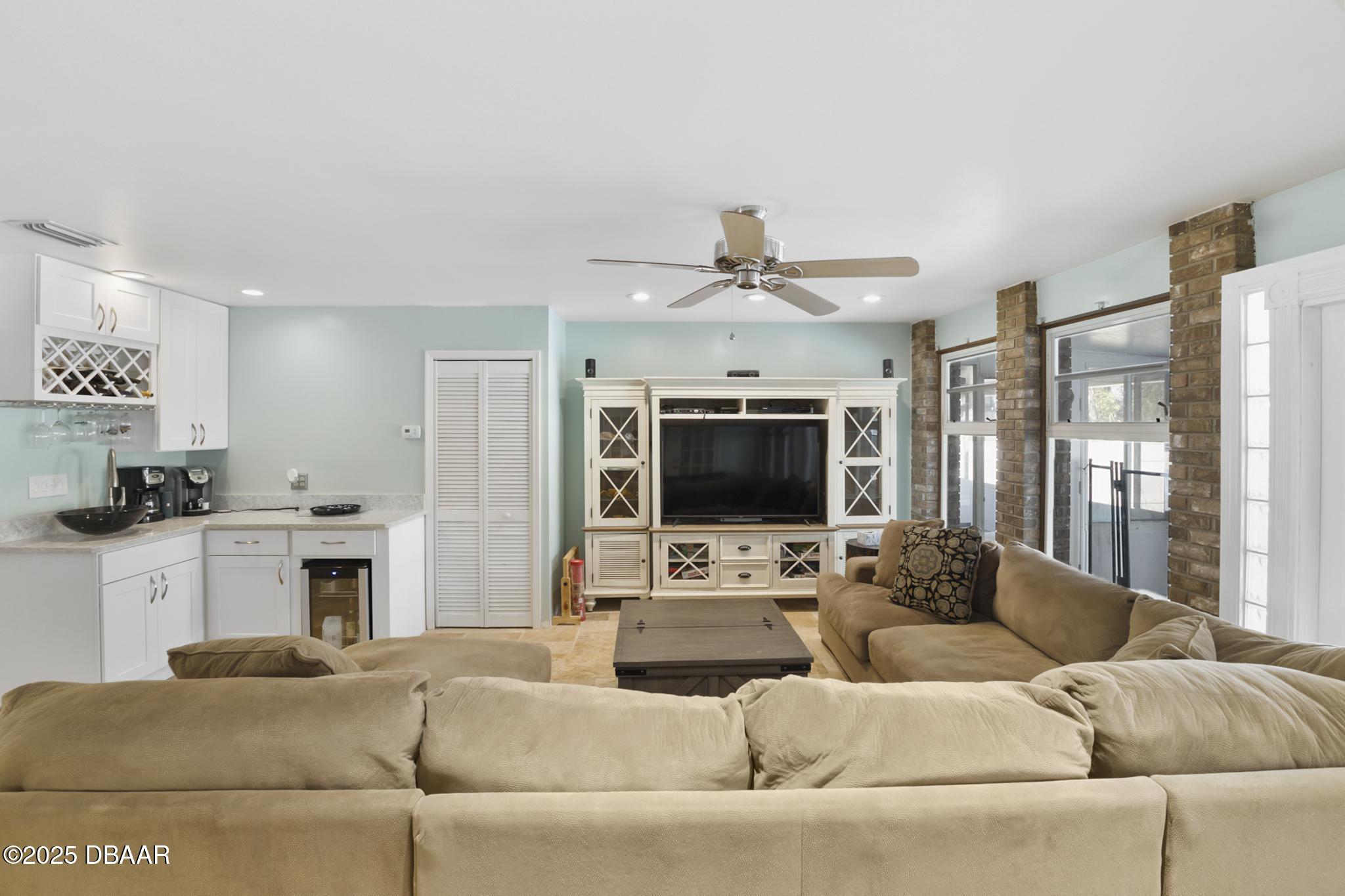 13 Fernery Trail Ormond Beach, FL 32174 - Photo 18 of 57 a living room with furniture and a flat screen tv