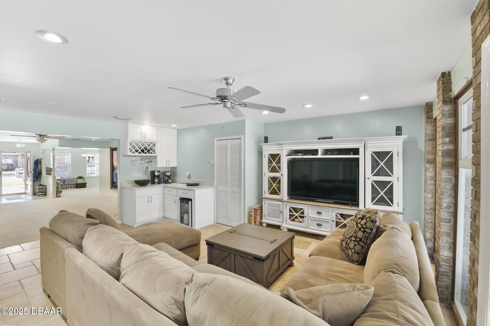 13 Fernery Trail Ormond Beach, FL 32174 - Photo 19 of 57 a living room with furniture and a flat screen tv